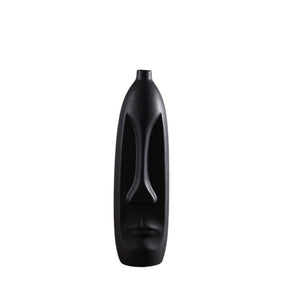 Black vase in the shape of a head