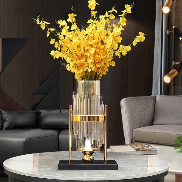 Modern transparent vase in glass tube and gold support