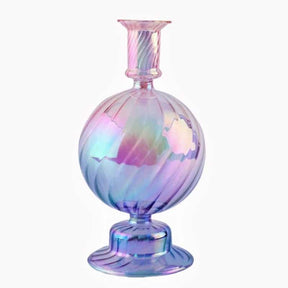 Purple glass vase in candle holder