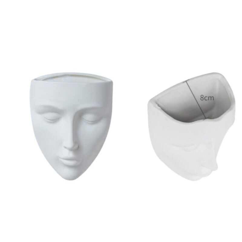 White face-shaped vase