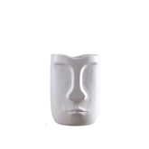 White head-shaped vase