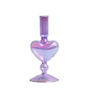 Purple glass vase in candle holder